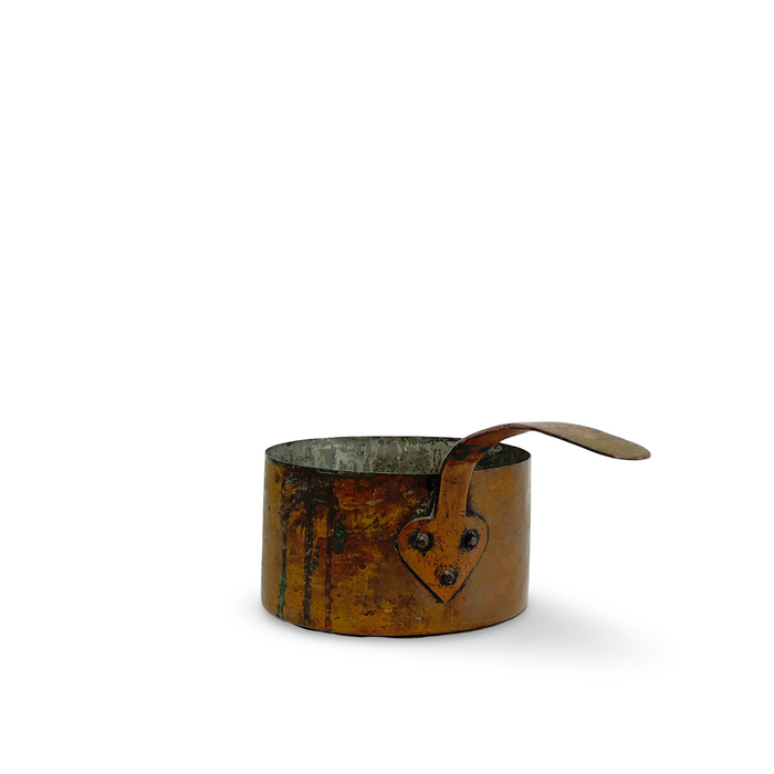 Aged copper pot with wide curved handle and stamped front plate