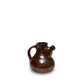 Brown speckled ceramic jug with curved handle and short spout
