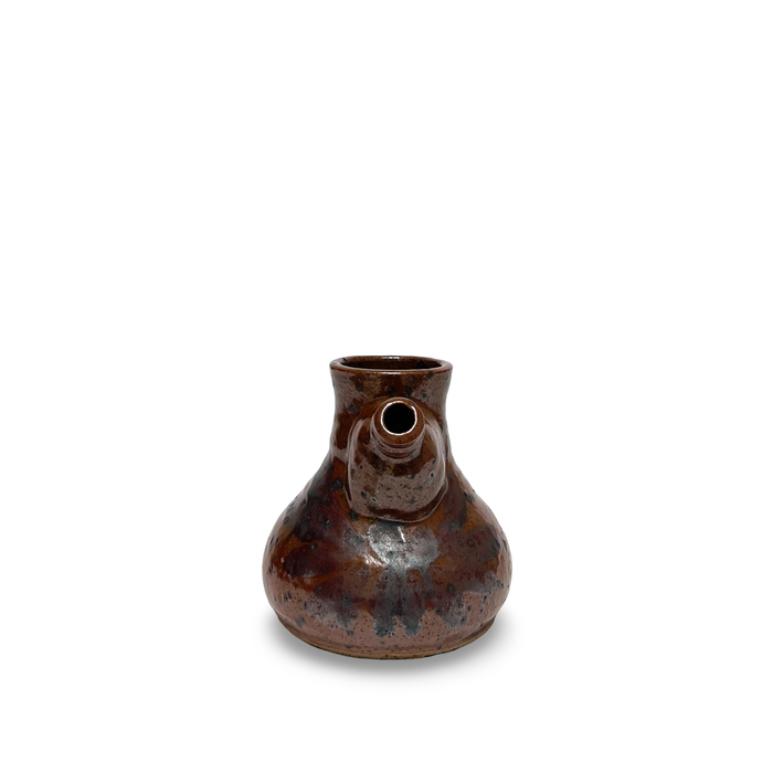Brown ceramic jug with open neck and rounded body, glazed speckle finish