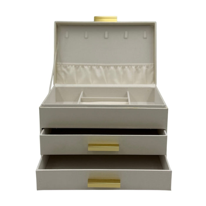 Ivory 3-tier faux leather jewelry box in ivory with champagne gold handles, featuring multiple compartments for jewelry storage.