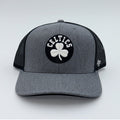 Gray and black 47 Brand Boston Celtics mesh snapback trucker hat with NBA logo and adjustable snap closure.