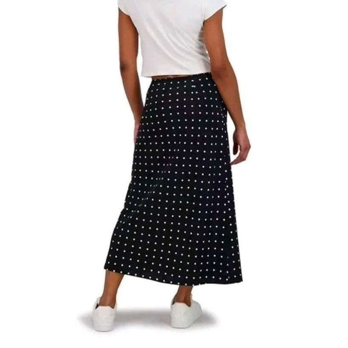 Aeropostale women's black polka dot maxi slip skirt, flowing and stylish, shown on a model.
