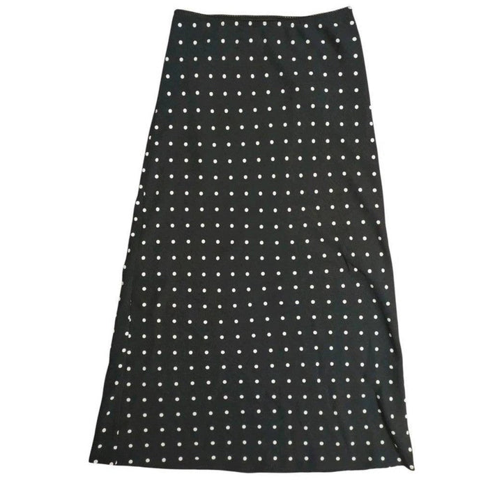 Black Aeropostale women's polka dot maxi slip skirt with a flowy silhouette and elastic waistband, ideal for casual or dressy wear.