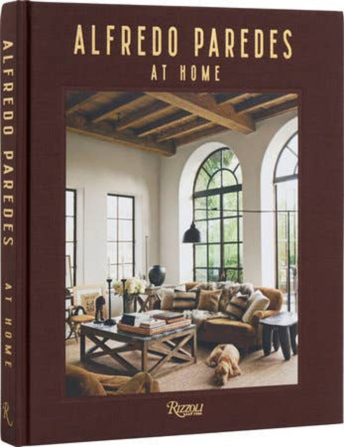 Hardcover photo book with brown cover and 'Alfredo Paredes at Home' title text