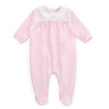 Pink baby onesie with a white collar on a white background