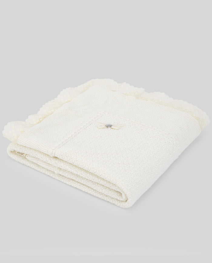 Folded white towel on a light gray background