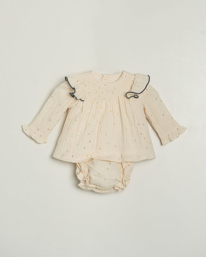 Baby outfit with long-sleeve top and diaper on a light gray background