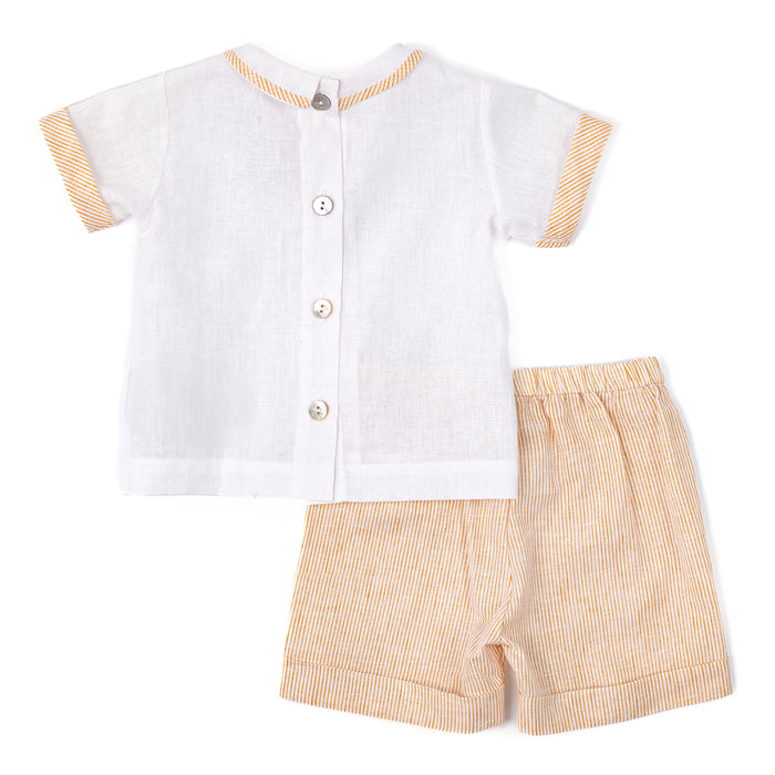 White shirt and beige shorts set on a white background