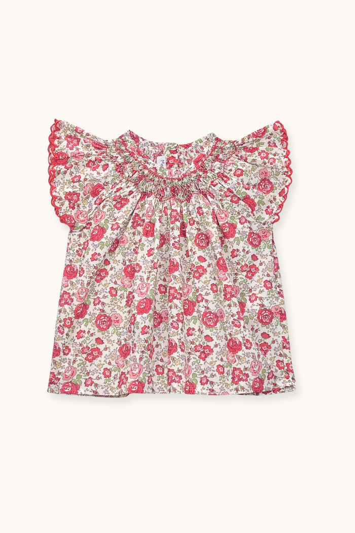 Floral blouse with ruffled sleeves on a white background