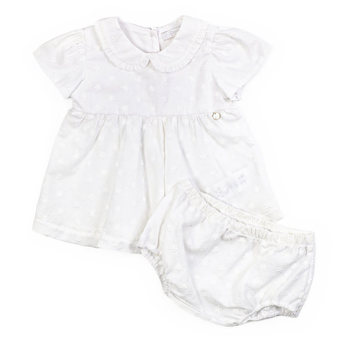 White baby romper with ruffled collar on a white background