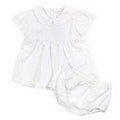 White baby romper with ruffled collar on a white background