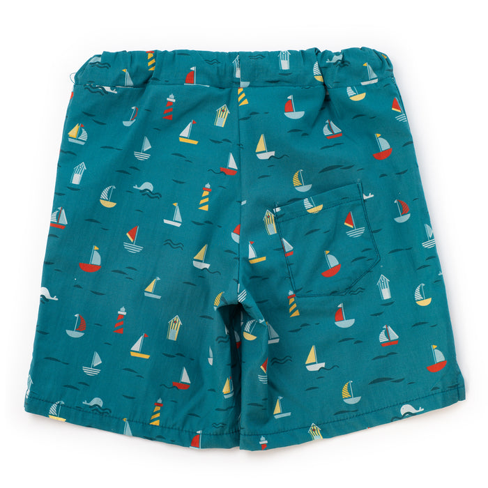 Teal shorts with sailboat pattern on a white background