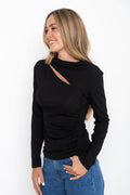 Carolyn long sleeve top in black, fitted top with asymmetric cutout neckline and ruched side detail, styled with denim jeans