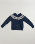 Blue knitted cardigan with a patterned collar on a light gray background