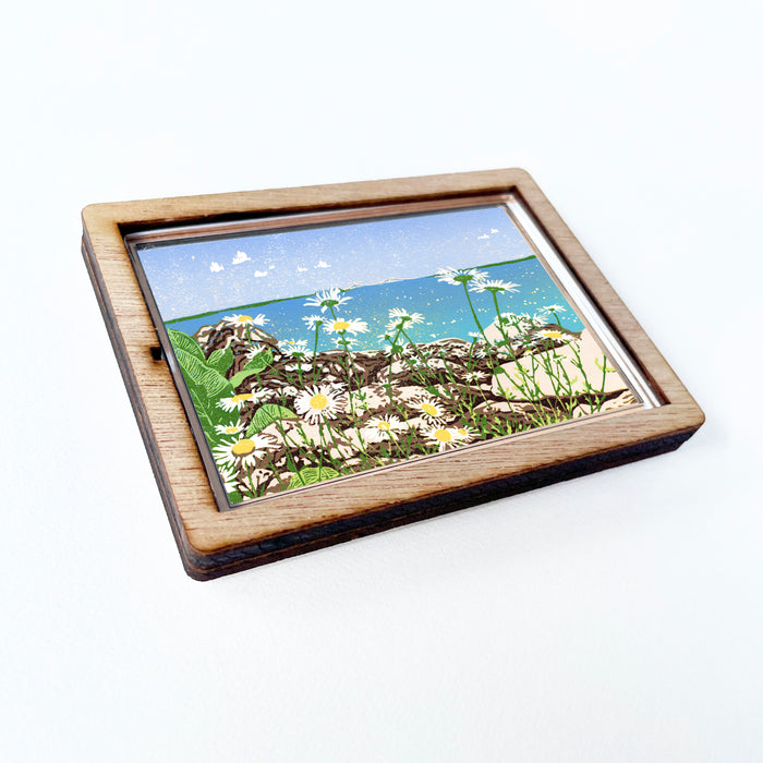 Decorative magnet featuring the block print, "Daisy Shore," by Peninsula Prints. The magnet has a protective clear coating and wooden frame.