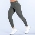 Olive green high-rise leggings with smooth flat seams and ankle-length fit