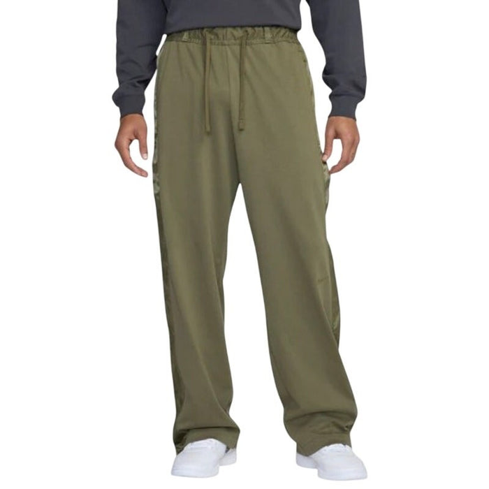 Nike Devin Booker men's olive green basketball pants in XXL, with Nike logo and athletic design visible.