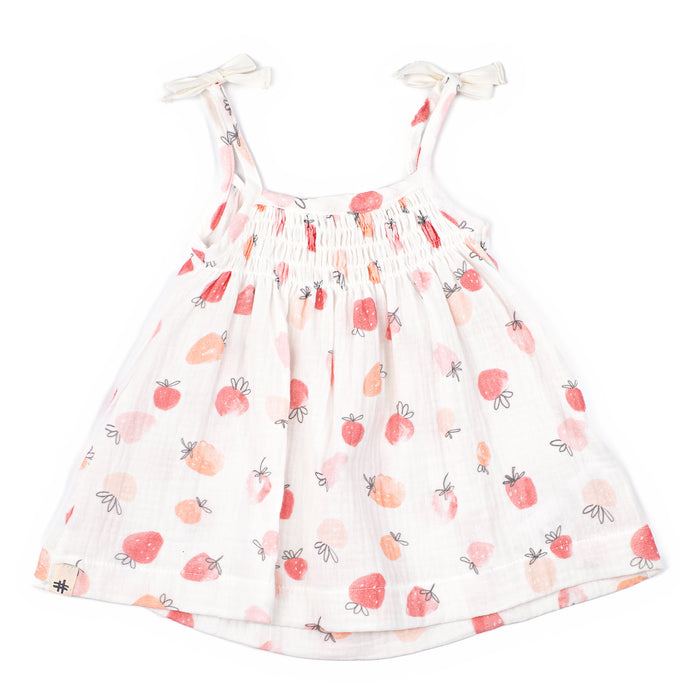 White dress with strawberry pattern on a white background