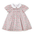 Floral dress with a white collar on a white background