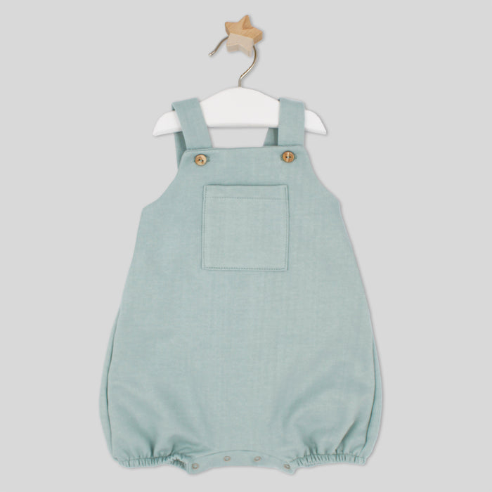 Light blue baby romper with straps on a white background