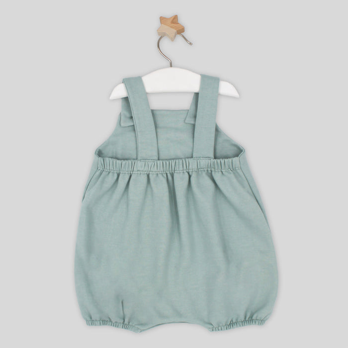 Light blue baby romper with straps on a white hanger against a light gray background