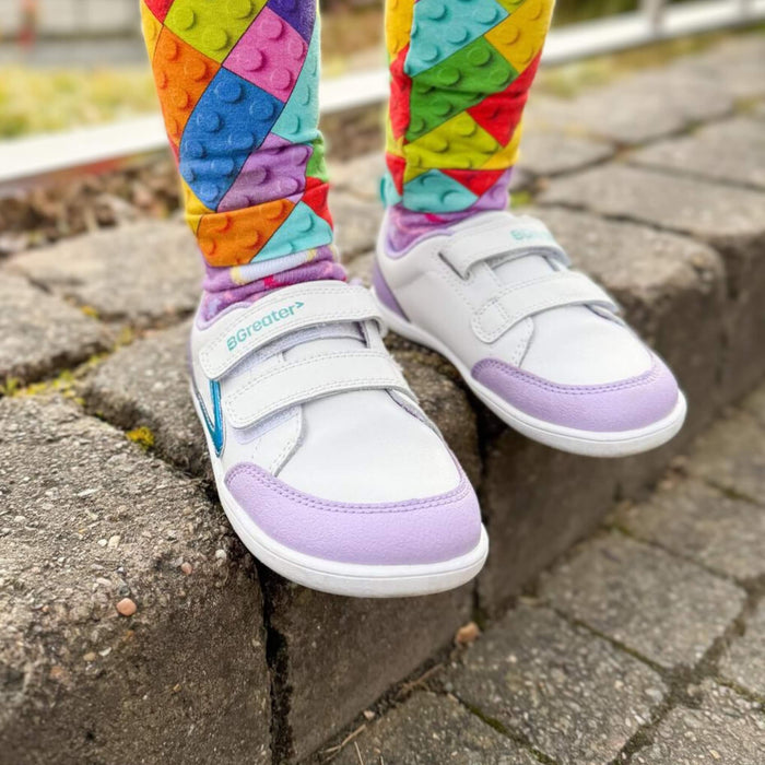 Toddler wearing Purple Barefoot Trainer In Park Close Up