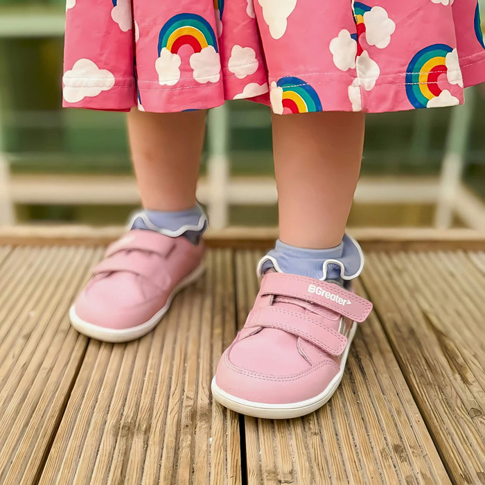 Close up of toddler posing in Pink Barefoot Trainers