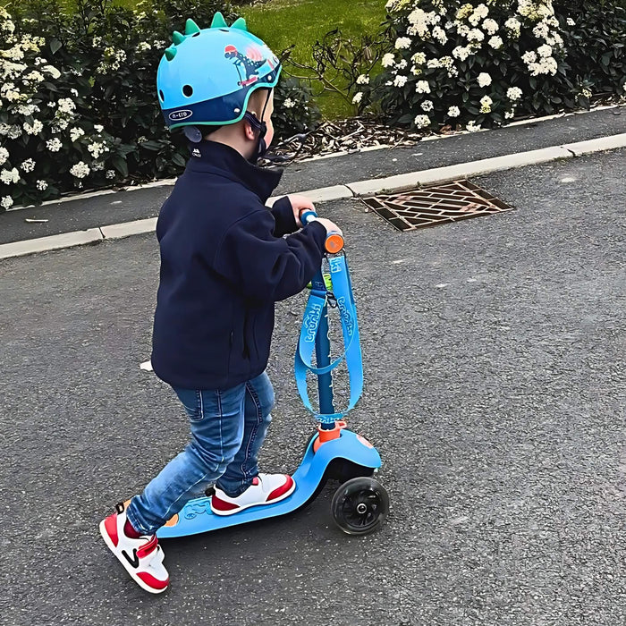 Kids riding scooter in red white toddler trainers