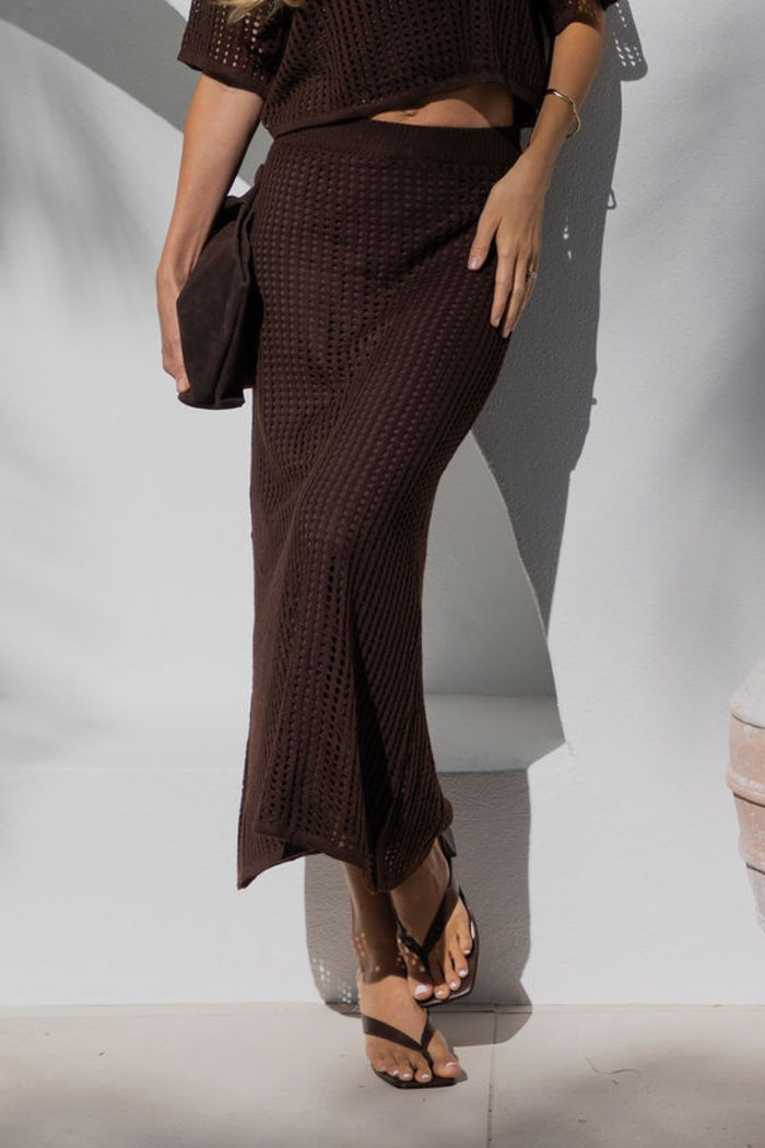 Florence crochet midi skirt in chocolate brown, open-weave knit skirt styled with matching crop top and thong sandals