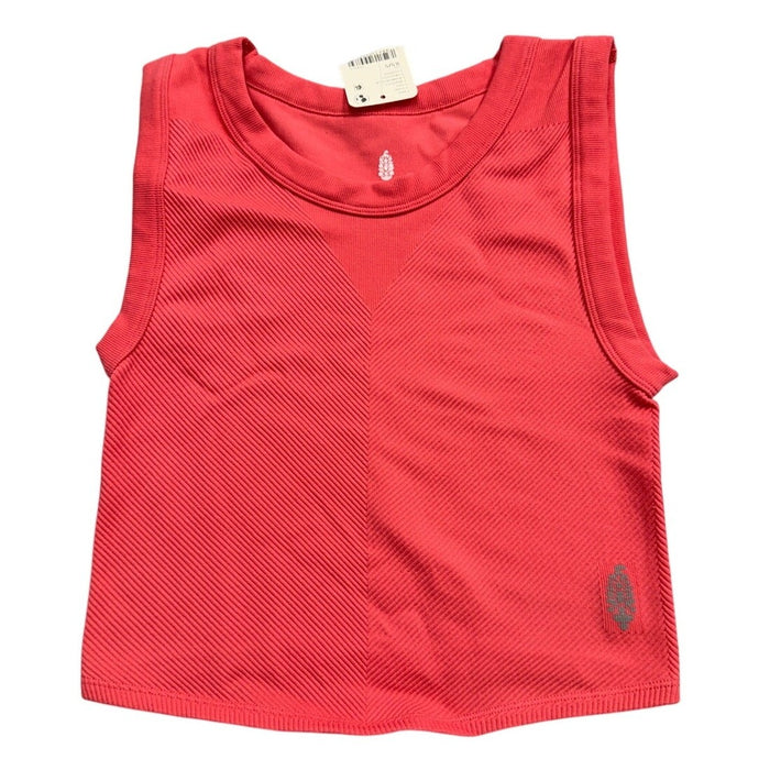 Fp Movement coral pink ribbed cropped tank top, performance workout shirt, XS/S size, displayed on a flat surface.
