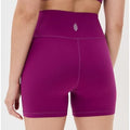 Free People Movement Never Better bike shorts in mulberry color, size large, shown laid flat on a white background.