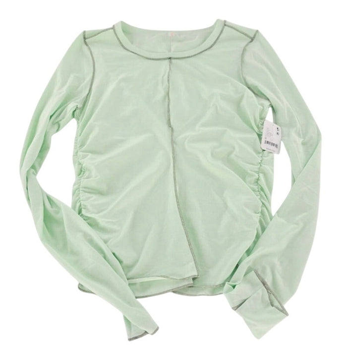 Free People Movement pistachio long sleeve T-shirt with crew neck and subtle branding, displayed flat on a white background.