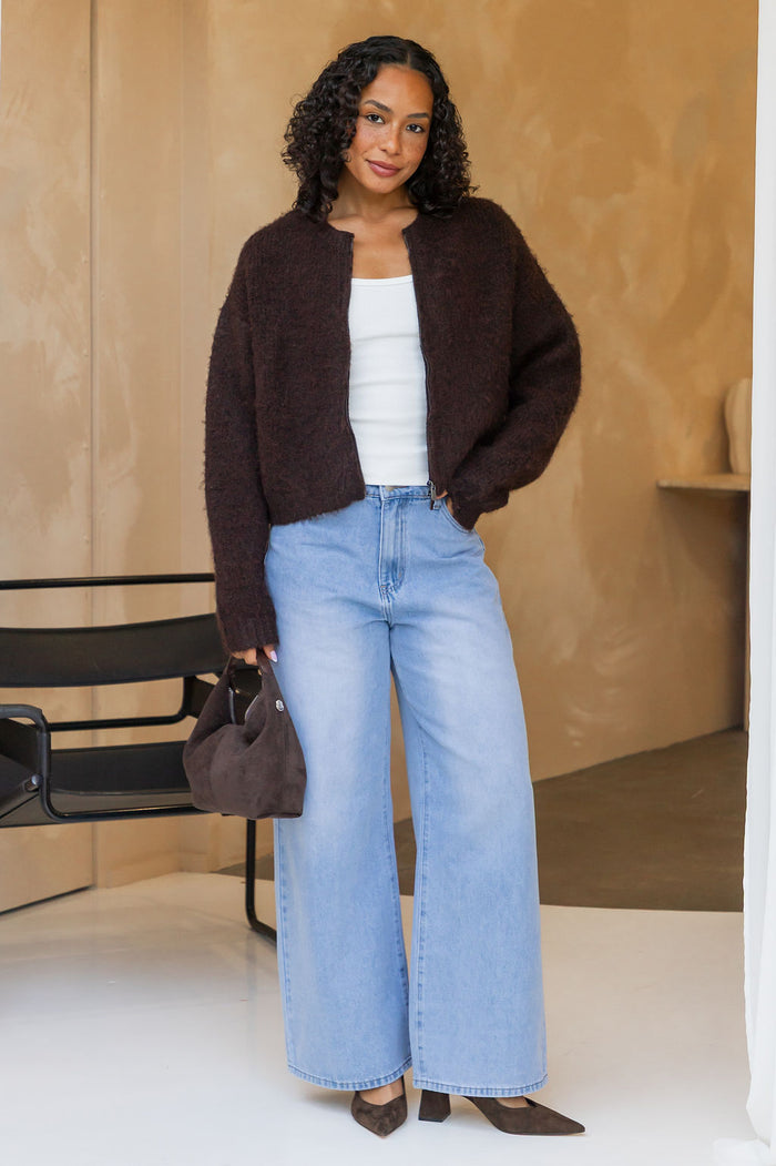 Freya Cardigan in chocolate brown, cropped fuzzy knit sweater with half-zip neckline and white singlet styled with light wash denim jeans and a brown suede bag