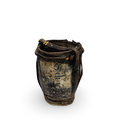 Antique metal water bucket with leather strap rim and rope handle, dark patina