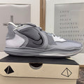 Nike Giannis Freak 6 TB men's basketball shoes in wolf grey, black, and white, featuring Nike branding and sporty design.