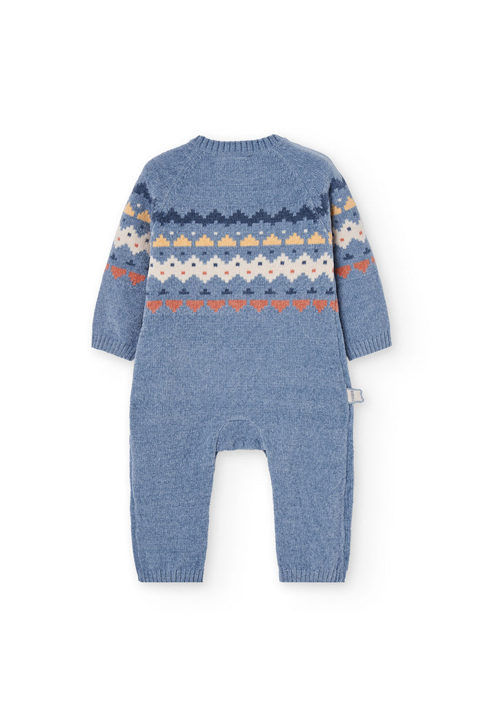 Blue knitted baby romper with a pattern on a white background