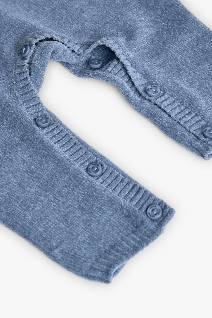 Blue baby leggings with buttons on a white background