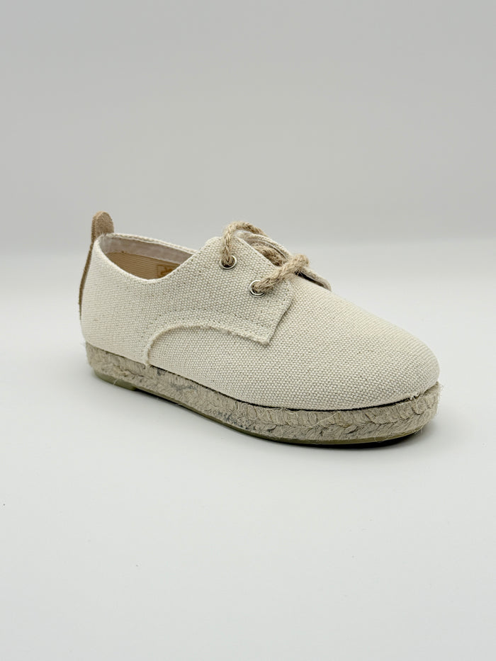 Beige shoe on a light gray background