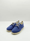 Pair of blue espadrilles with jute soles on a white background