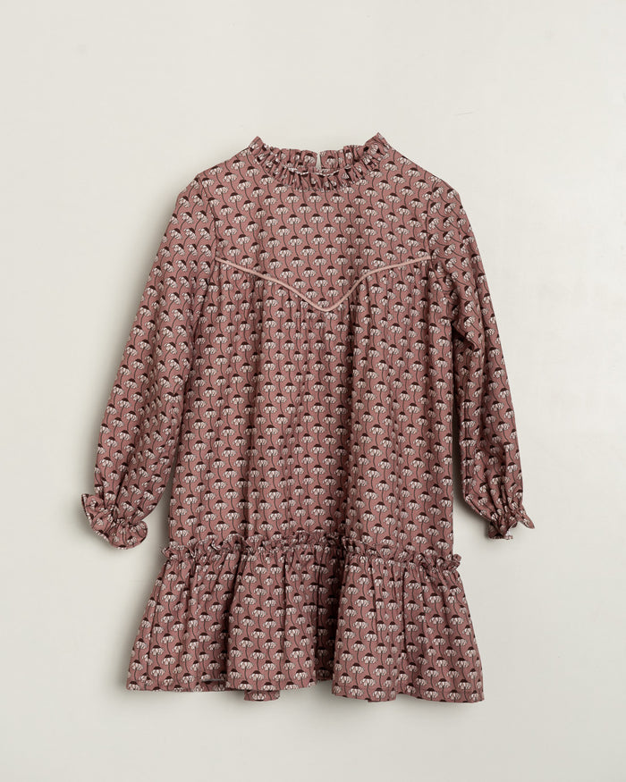 Pink patterned dress on a light beige background