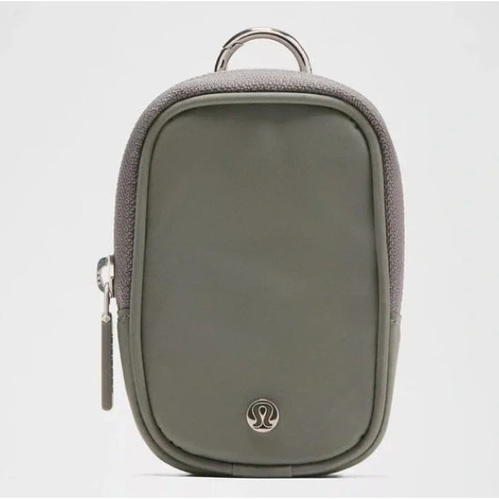 Lululemon Clippable Nano Pouch keychain handbag in olive color with clip attachment and compact design.