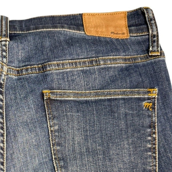 Madewell women's high riser skinny jeans in size 32, dark denim with a fitted silhouette and classic five-pocket design.