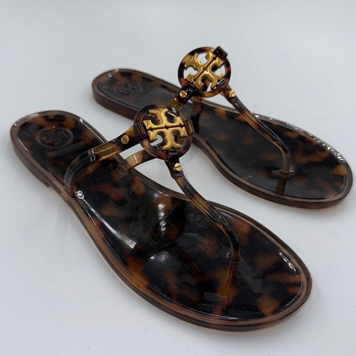 Tory Burch Mini Miller Jelly Sandals in tortoise shell, women's size 8, showcasing the stylish and transparent sandal design.