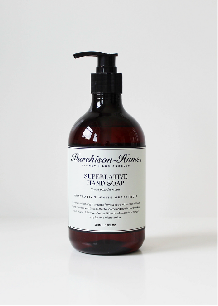 Amber hand soap bottle with black pump, labeled Australian White Grapefruit