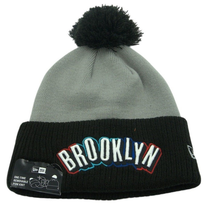 New Era Brooklyn Nets knit beanie with embroidered logo and removable pom, soft knit fabric, stylish winter hat.
