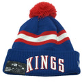 Youth NBA Sacramento Kings pom beanie hat in blue and red, knit with team logo and pom pom on top.