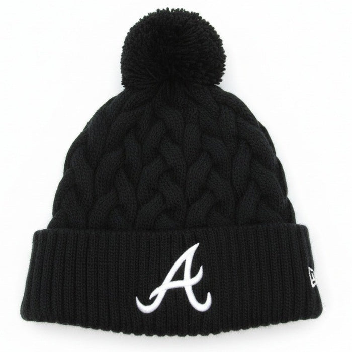 New Era women's Atlanta Braves knit beanie with pom in black, featuring team logo and cozy knit fabric.