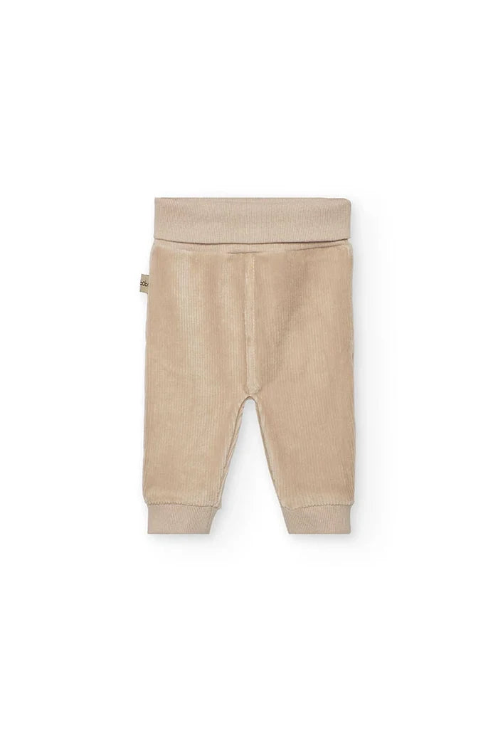 Beige baby pants on a white background