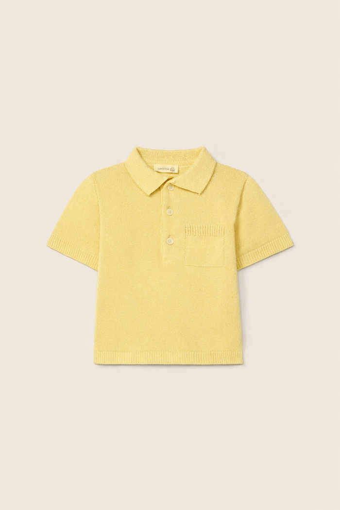 Yellow polo shirt on a beige background