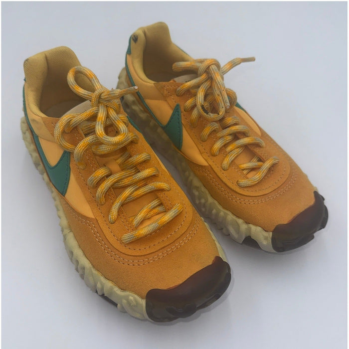 Nike OverBreak SP women's sneakers in Pollen Rise and Neptune Green, featuring a sporty design and athletic style.